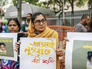 A 35-year-old who forcibly shaved his wife's head after finding a hair in his breakfast has today been arrested. Pictured are protesters against sexual violence in Bangladesh . (AFP/ File Photo)