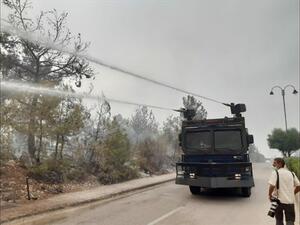 Riot control vehicles mounted with water cannons are employed to fight the fires in Chouf on Tuesday, Oct. 15, 2019. (The Daily Star/Mohammed Zaatari)