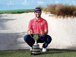 Rahm celebrates with the Mutuactivos Open de España trophy