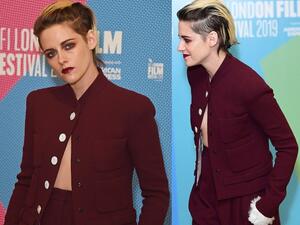 Racy: The actress, 29, teased her taut midriff and risked a wardrobe malfunction in an unbuttoned scarlet blazer adorned with white buttons. (Daily Mail/ Dave Benett/Wire Image)