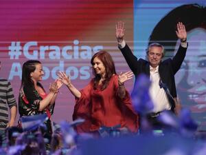 Argentina’s President-elect Alberto Fernandez, right, and Vice President Cristina Fernandez wave to supporters at the party’s headquarters in Buenos Aires on Sunday. (Alejandro Pagni / AFP/Getty Images)