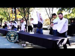 Employees at an Idaho company broke a Guinness world record when 10 people managed to pass 10 T-shirts down a line in just under 2 minutes. (YouTube)