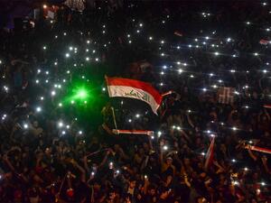 Iraqi protesters gather during a late anti-government demonstration in Nasiriyah, the capital of the southern province of Dhi Qar on November 4, 2019.  (AFP)