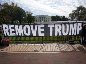 Activists hold a banner asking for the impeachment of US President Donald Trump on November 5, 2019 in front of the White House in Washington,DC. US voters headed to polls Tuesday in several states with governorships or legislatures at stake, in early tests of enthusiasm for and against President Donald Trump ahead of the 2020 elections. Mandel Ngan / AFP