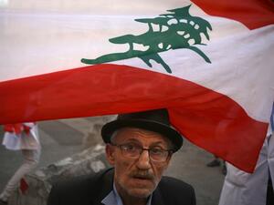 A Lebanese elderly man takes part in ongoing anti-government demonstrations in central Beirut on November 12, 2019. Banks and schools in Lebanon were closed today as protesters tried to prevent employees from clocking in at state institutions nearly one month into an anti-graft street movement. Protesters are demanding a fresh cabinet include independent experts not affiliated to traditional political parties, but no date has yet been set for required parliamentary consultations. PATRICK BAZ / AFP