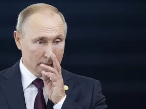 Russia's President Vladimir Putin gestures before the 11th BRICS Summit at the Itamaraty palace on November 14, 2019 in Brasilia, Brazil. Brazil's President Jair Bolsonaro walked a diplomatic tightrope, as he seeks to boost ties with Beijing and avoid upsetting key ally Donald Trump, on the eve of a summit with their BRICS counterparts from Russia, India and South Africa. Pavel Golovkin / POOL / AFP