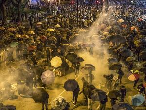 Protesters react as police fire tear gas while they attempt to march towards Hong Kong Polytechnic University in Hung Hom district of Hong Kong on November 18, 2019. (AFP/ File Photo)