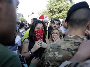Lebanese protesters stand next to security forces near parliament headquarters in the capital Beirut on November 19, 2019. (AFP/ File Photo)