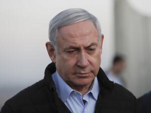 Israel's Prime Minister Benjamin Netanyahu looks on during a visit to an army base in the Israeli-annexed Golan Heights overlooking Syrian territory, on November 24, 2019. ATEF SAFADI / POOL / AFP