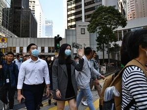Office workers shout slogans during a lunchtime protest in the Central district in Hong Kong on November 25, 2019, a day after the city went to the polls to vote in local elections. (AFP/ File Photo)