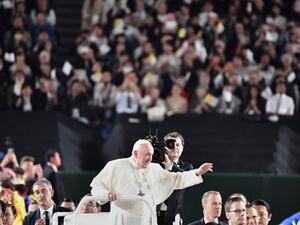 Pope Francis waves upon his arrival for a holy mass at the Tokyo Dome stadium in Tokyo on November 25, 2019. Pope Francis called on November 25 for renewed efforts to help victims of Japan's 2011 "triple disaster" of earthquake, tsunami and the Fukushima meltdown, noting "concern" in the country over the continued use of nuclear power. Vincenzo PINTO / AFP