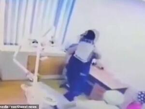 A video showing the horrific episode in Aktau, Kazakhstan, captures the moment the dentist picks the boy up, shakes him and pushes him into the chair. (Social Media/ Video Screenshot)