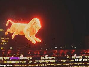 The lion is seen jumping onto the pitch as patches of turf erupt into 'flames' where the lion's feet touched the grass. (Daily Mail/ Golders/ Ede lpOfficial)