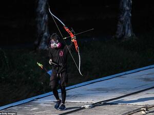 A protester wielding a bow and arrow walks along a footbridge roof. Hong Kong returned to Chinese rule under a 'one country, two systems' formula guaranteeing its colonial-era freedoms. (AFP/ File)