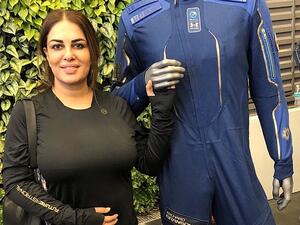 'The space suit (pictured here with Ms Salim) just needs a little bit of a tweak. And it's just amazing, the excitement building up and the whole plan on how it's going to happen', the future astronaut told Yahoo Finance. (Twitter)