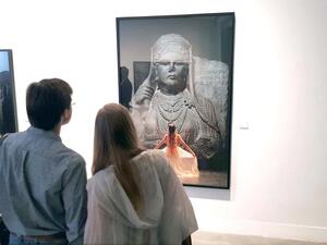 A tale of past, present and future. Visitors view a photograph by Majida Khattari. (Saad Guerraoui)