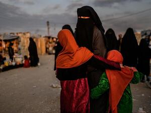 A veiled woman looks back at Al Hol camp in Hasakeh governorate in northeastern Syria. (AFP/ File Photo)