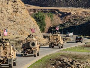 A convoy of US armored vehicles patrols the village of Ein Diwar in Syria's northeastern Hasakah province on November 4, 2019. (Photo by AFP)