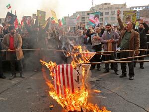 Iranian pro-government demonstrators burn makeshift US flags as they gather in the capital Tehran's central Enghelab Square on November 25, 2019, to condemn days of "rioting" that Iran blames on its foreign foes. (AFP/ File Photo)