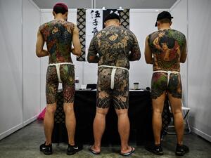 Malaysian officials slammed a tattoo exhibition held in the country as "porn" unsuitable for a Muslim-majority country, after images of half-naked men and women went viral (AFP)