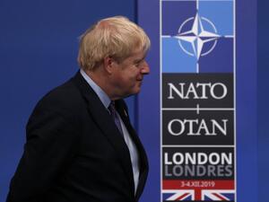 Britain's Prime Minister Boris Johnson waits for arrivals at the NATO summit at the Grove hotel in Watford, northeast of London on December 4, 2019. Adrian DENNIS / AFP