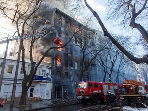 Firefighters extinguish a fire inside a college building in central Odessa on December 4, 2019. Ukrainian President Volodymyr Zelensky warned on December 5, 2019 that a deadly fire in the southern port city of Odessa could claim more victims, saying 14 people were still missing. Oleksandr GIMANOV / AFP