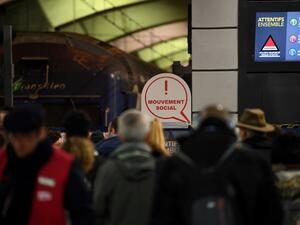 Commuters stand on a SNCF regional train platform at Gare du Nord in Paris on December 11, 2019 during a strike of public transports operator SNCF and RATP employees over French government's plan to overhaul the country's retirement system, as part of a national strike. Alain JOCARD / AFP