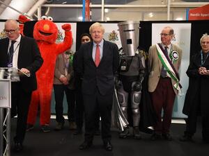 Britain's Prime Minister and Conservative leader Boris Johnson (C) reacts as the results are read out for the race to be MP for Uxbridge and Ruislip South at the count centre in Uxbridge, west London, on December 13, 2019 after votes were counted as part of the UK general election. AFP