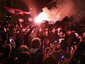 A Lebanese demonstrator uses a flare during an anti-government protest in the downtown area of the capital Beirut, on December 15, 2019.  (AFP/ File Photo)
