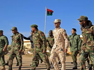 Fighters of a military battalion loyal to Libyan General Khalifa Haftar march during the morning assembly in the eastern city of Benghazi on December 18, 2019. Abdullah DOMA / AFP