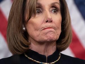 US Speaker of the House Nancy Pelosi holds a press conference after the House passed Resolution 755, Articles of Impeachment Against President Donald J. Trump, at the US Capitol in Washington, DC, on December 18, 2019. The US House of Representatives voted 229-198 on Wednesday to impeach President Donald Trump for obstruction of Congress. The House impeached Trump for abuse of power by a 230-197 vote. The 45th US president is just the third occupant of the White House in US history to be impeached. SAUL LOE