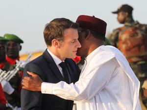 France's President Emmanuel Macron (L) is greeted by Niger's President Mahamadou Issoufou as they take part in a military ceremony at the Martyr Quarter on December 22, 2019, in Niamey, to pay homage to 71 Nigerien soldiers massacred in an attack on December 10 at the Inates military camp in the Sahel country's western Tillaberi region. Ludovic MARIN / POOL / AFP