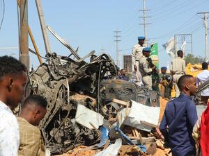 The wreckage of a car that was destroyed during the car bomb that exploded in Mogadishu that killed more than 20 people is photographed in Mogadishu on December 28, 2019. A massive car bomb exploded in a busy area of the Somali capital Mogadishu on December 28, 2019, leaving more than 20 people dead. Abdirazak Hussein FARAH / AFP