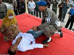 An Indonesian man is whipped in public in the Aceh province on charges of pre-marital sex on Thursday, a serious crime in the conservative region's Islamic law. AFP