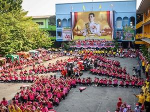 Elephants perform during the gift-giving event at the Jirasartwitthaya kindergarten school in Ayutthaya (AFP)