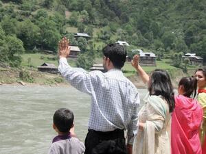 Families wave to their relatives on the Indian side of the Neelum River. (AFP/ File Photo)