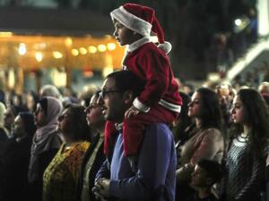Palestinian Christians attend a Christmas tree lighting celebration in Gaza City [AFP/Getty]