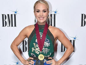 She completed the show-stopping look with a pair of diamond hoop earrings and matching rings. 