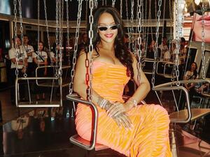 Rihanna's luxuriant dark tresses are down, and she wears a classic pop of red color on her lips (source: @badgalriri Instagram)
