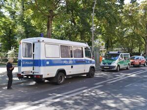 Picture taken on August 23, 2019 shows police cars parked close to the site of a crime scene in Berlin's Moabit district, where a man of Georgian origin was shot dead. (DPA/AFP via Getty Images)