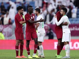Qatar's players shake hands and embrace with Saudi's after the 24th Arabian Gulf Cup semi-final football match between Saudi Arabia and Qatar at al-Janoub Stadium in the Qatari capital Doha on December 5, 2019. MUSTAFA ABUMUNES / AFP