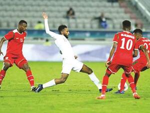 Saudi Arabia’s Feras Albrikan (second from left) in action during the 24th Arabian Gulf Cup match against Oman at Abdullah Bin Khalifa Stadium yesterday. Photo: Shemeer Rasheed