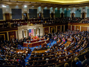Members of the 115th congress and their familes mingle on the house floor while attending the joint session on the opening day of the current session. (Shutterstock/ File Photo)