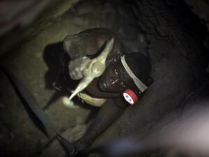 A gold miner works underground in Anka near Gusau, on December 4,2019. For generations, the mineral-rich earth of Nigeria's Zamfara state has provided families living here with a way to make ends meet. But in recent years their trade has become increasingly unsafe. The mines lie within the reach of heavily-armed groups -- dubbed "bandits" by the local authorities -- that have been terrorising this remote region.  Kola Sulaimon / AFP