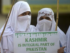 Women supporters of Pakistani political and Islamic party Jammat-e-Islami (JI), hold placards as they march during a protest in solidarity with Indian Kashmiri Muslims in Islamabad on December 22, 2019. Aamir QURESHI / AFP