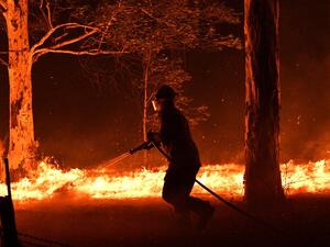 Fire-ravaged Australia has launched a major operation to reach thousands of people stranded in seaside towns after deadly bushfires ripped through popular tourist areas on New Year's Eve. SAEED KHAN / AFP