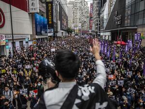People take part in a pro-democracy march in Hong Kong on January 1, 2020. Tens of thousands of protesters marched in Hong Kong during a massive pro-democracy rally on New Year's Day, looking to carry the momentum of their movement into 2020.  ISAAC LAWRENCE / AFP