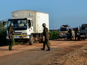 Kenyan police officers check vehicles on a road after a bus, travelling from the coastal region of Lamu to the town of Malindi, was ambushed by gunmen in Lamu county, southeast Kenya, on January 2, 2020. (AFP/ File Photo)