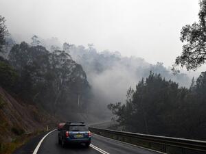 Firefighters were racing to contain massive bushfires across southeastern Australia Tuesday amid easing conditions as another heatwave loomed, as officials said the damage bill for the months-long crisis had risen to almost half a billion dollars.  SAEED KHAN / AFP