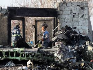 Rescue teams work amidst debris after a Ukrainian plane carrying 176 passengers crashed near Imam Khomeini airport in the Iranian capital Tehran early in the morning on January 8, 2020, killing everyone on board. The Boeing 737 had left Tehran's international airport bound for Kiev, semi-official news agency ISNA said, adding that 10 ambulances were sent to the crash site. AFP